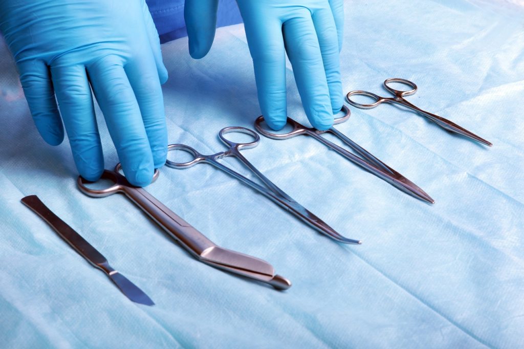 A wide shot of sterilized surgical instruments laid down on a table