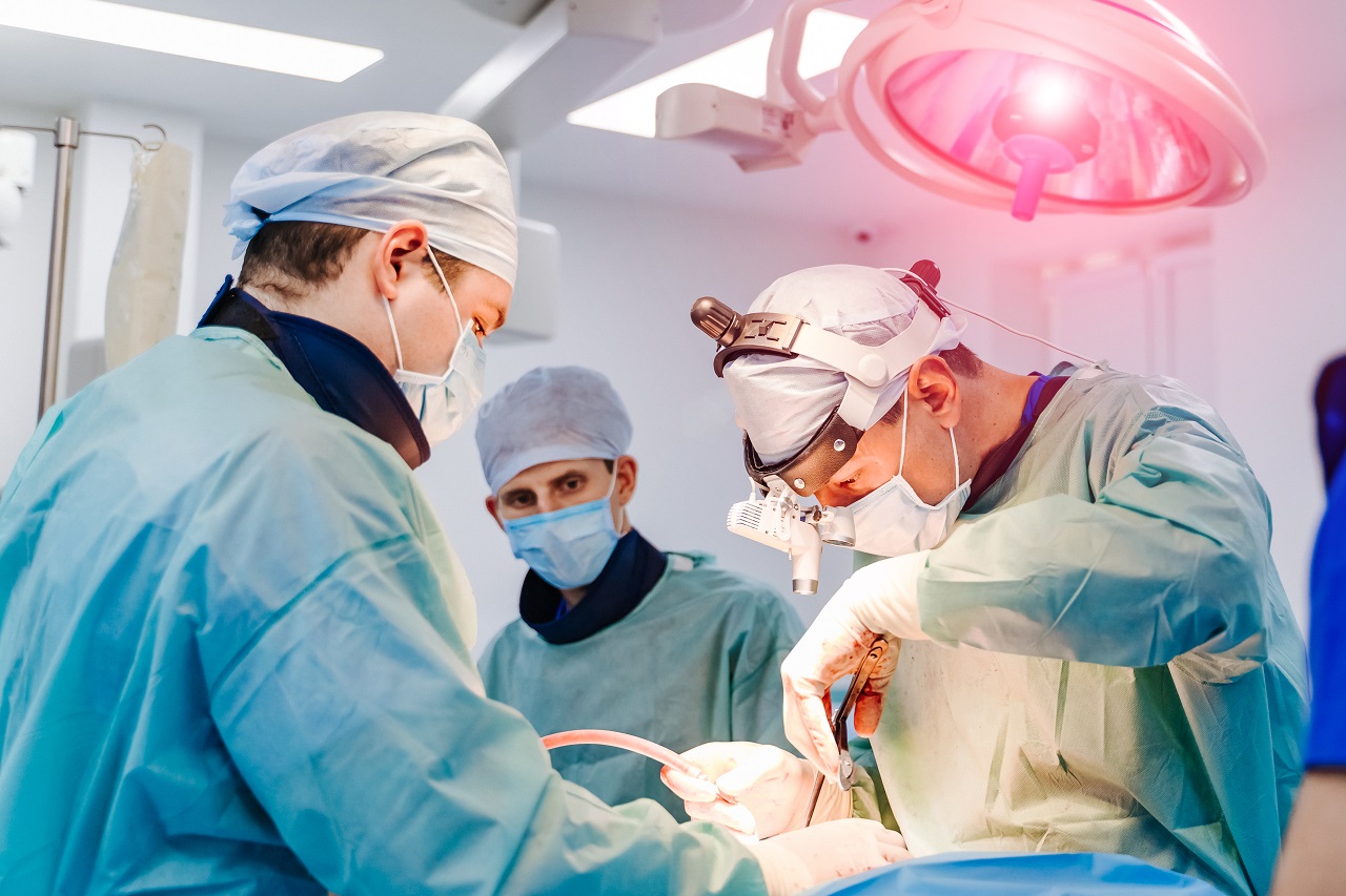 Surgeons operating on a patient
