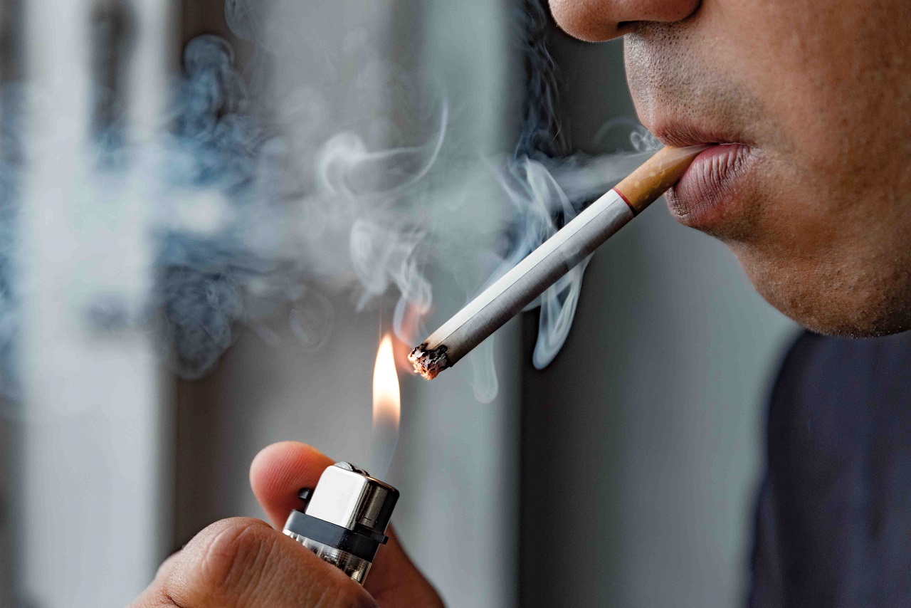 Close up of a man smoking a cigarette