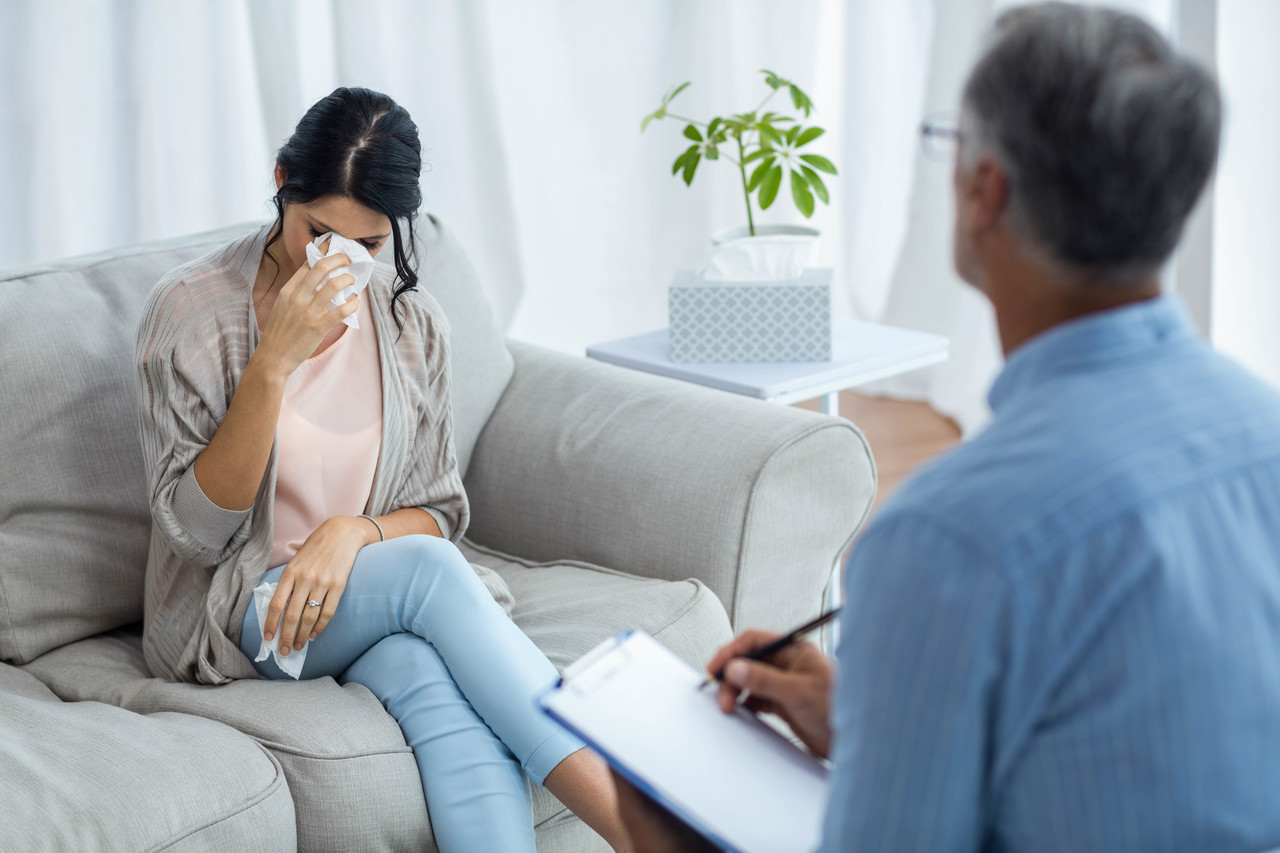 A mother crying because of a miscarriage