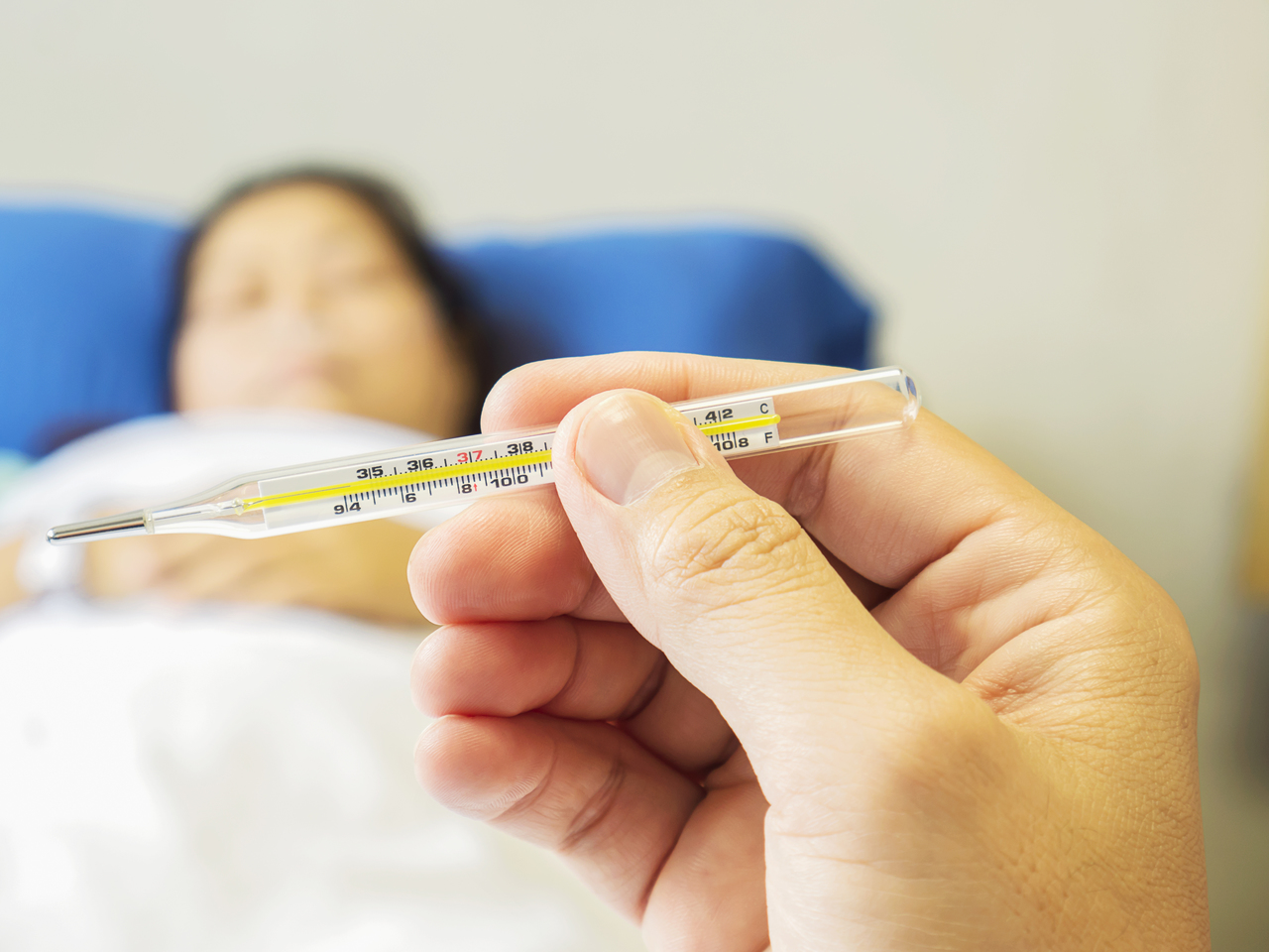 Close up of thermometer results of a woman with fever