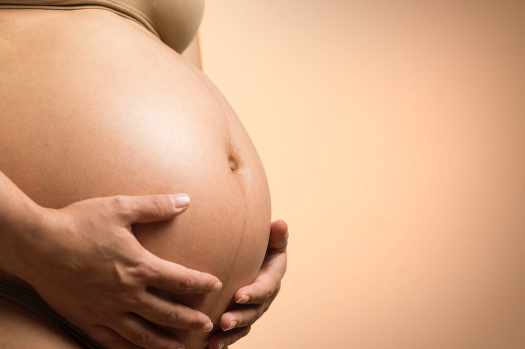 A pregnant woman preparing for a cesarean delivery