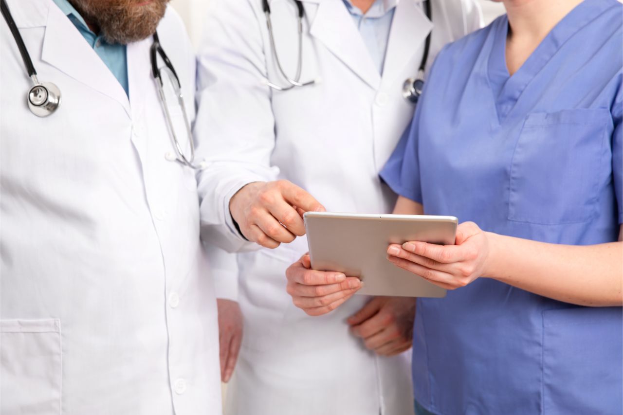 Doctor in medical team discussing patient