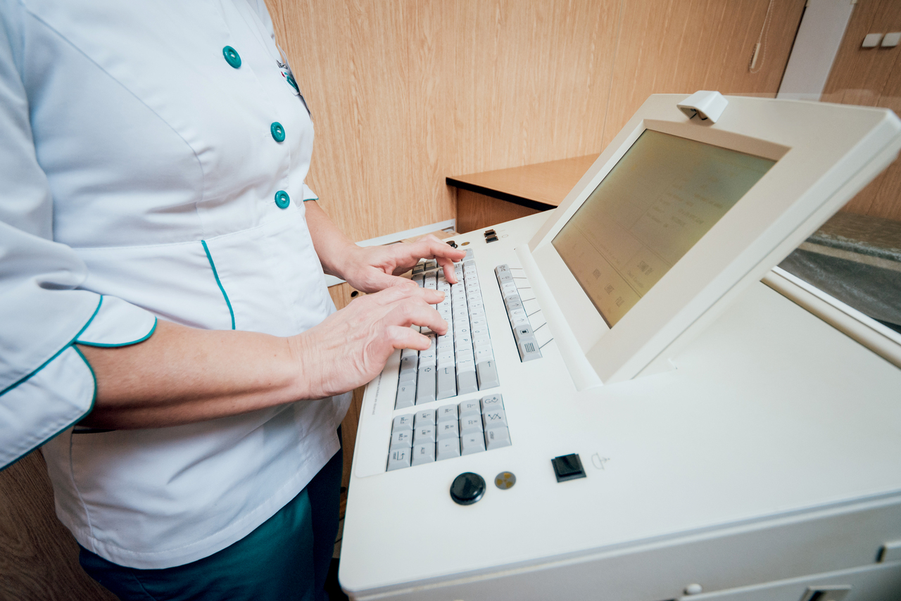 Medical professional looking at mammography test