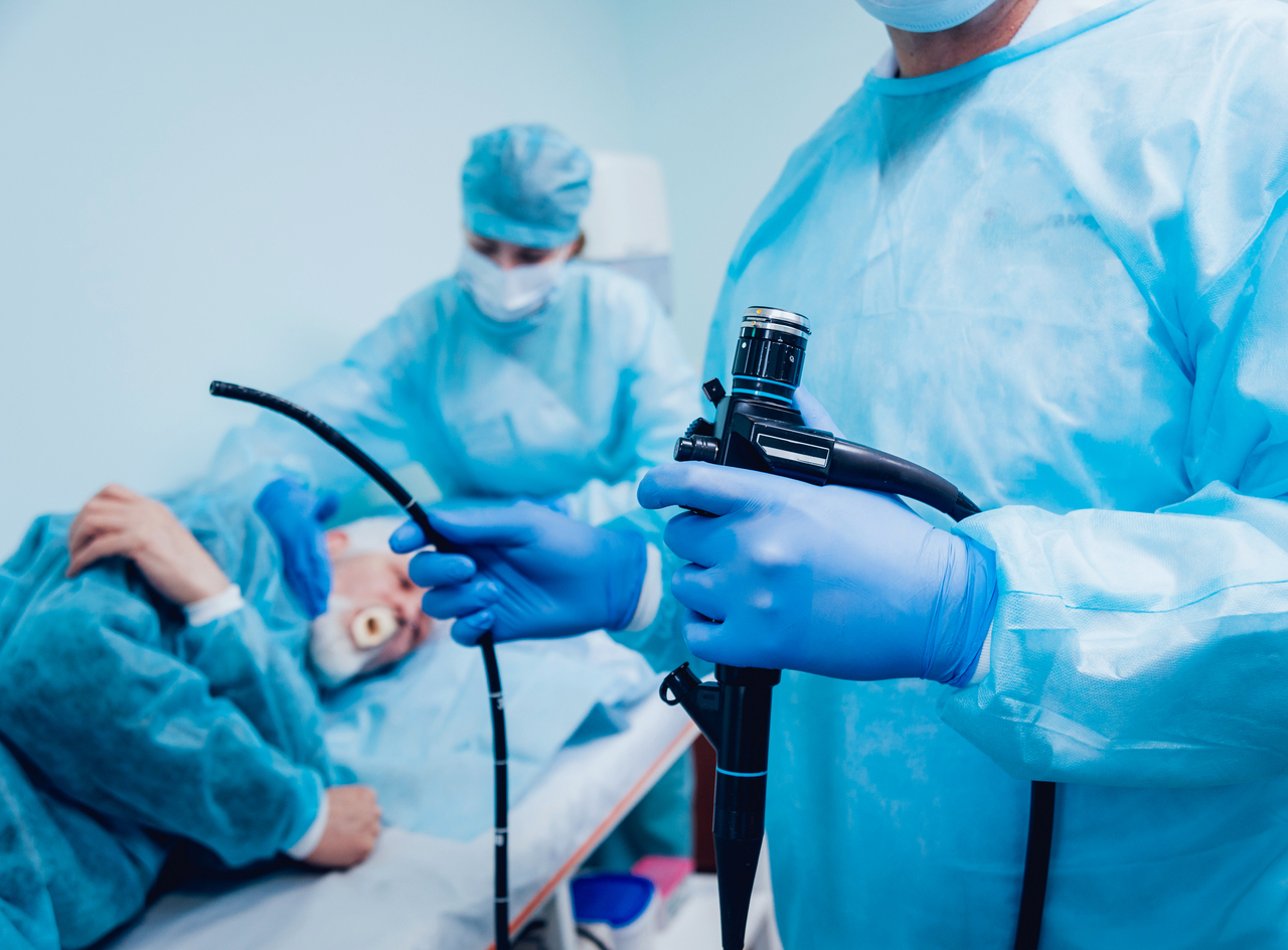 Doctor holding endoscope before gastroscopy